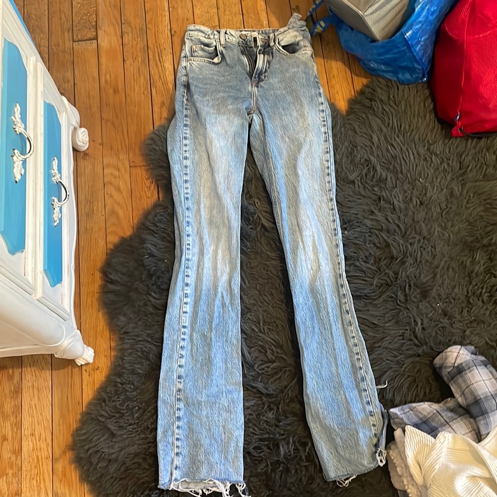 Light blue boot cut jeans.